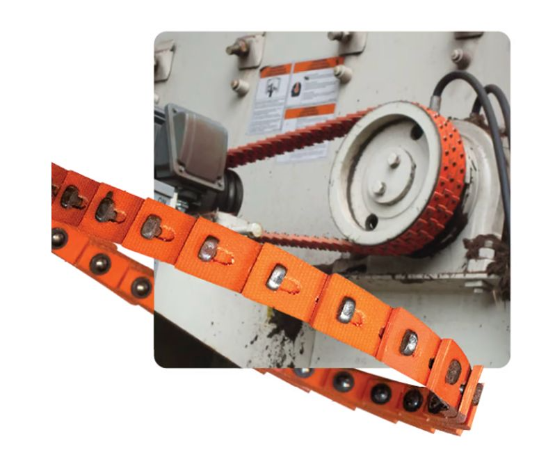Orange PU link belt installed on an industrial drive pulley